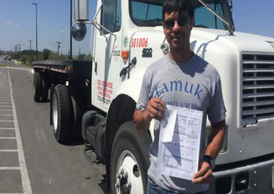 CDL School Killeen - Graduation day with students holding their CDL certificates proudly.