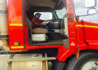 CDL School Killeen - Students practicing on truck driving simulators with guidance from an instructor.